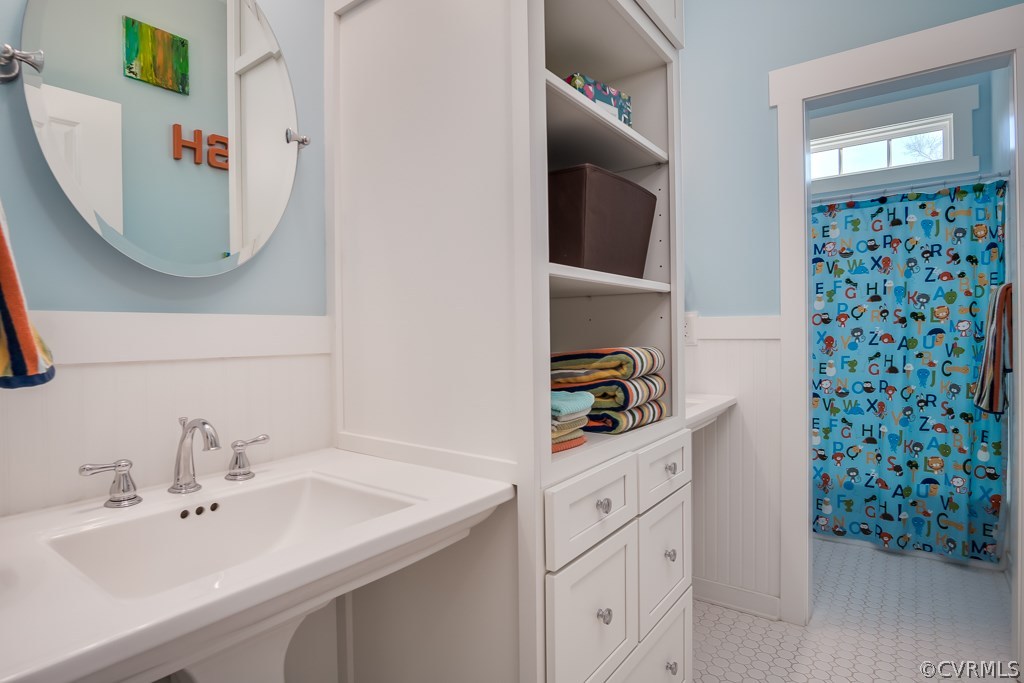 16006 Alsdell Road Midlothian, VA 23112 - Photo 32 of 46 a bathroom with a sink and a mirror