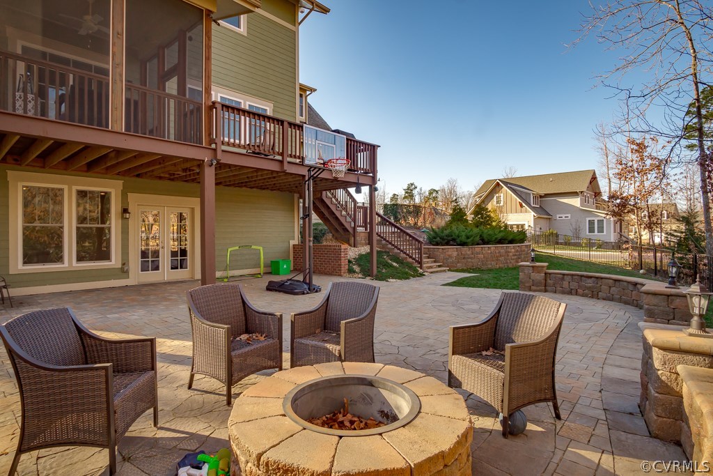 16006 Alsdell Road Midlothian, VA 23112 - Photo 43 of 46 a view of a patio with table and chairs with wooden floor and fence