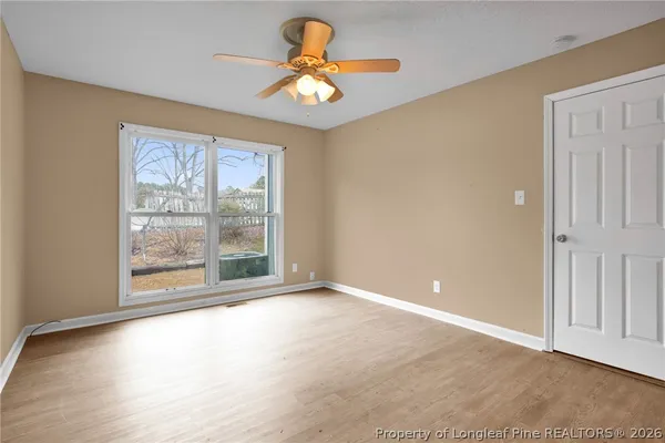 a view of an empty room with a window