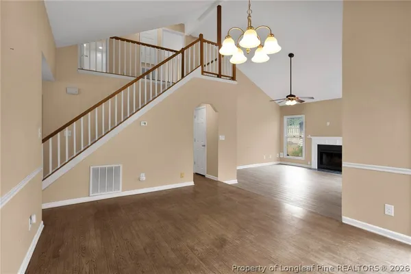 a view of entryway and hall with a chandelier