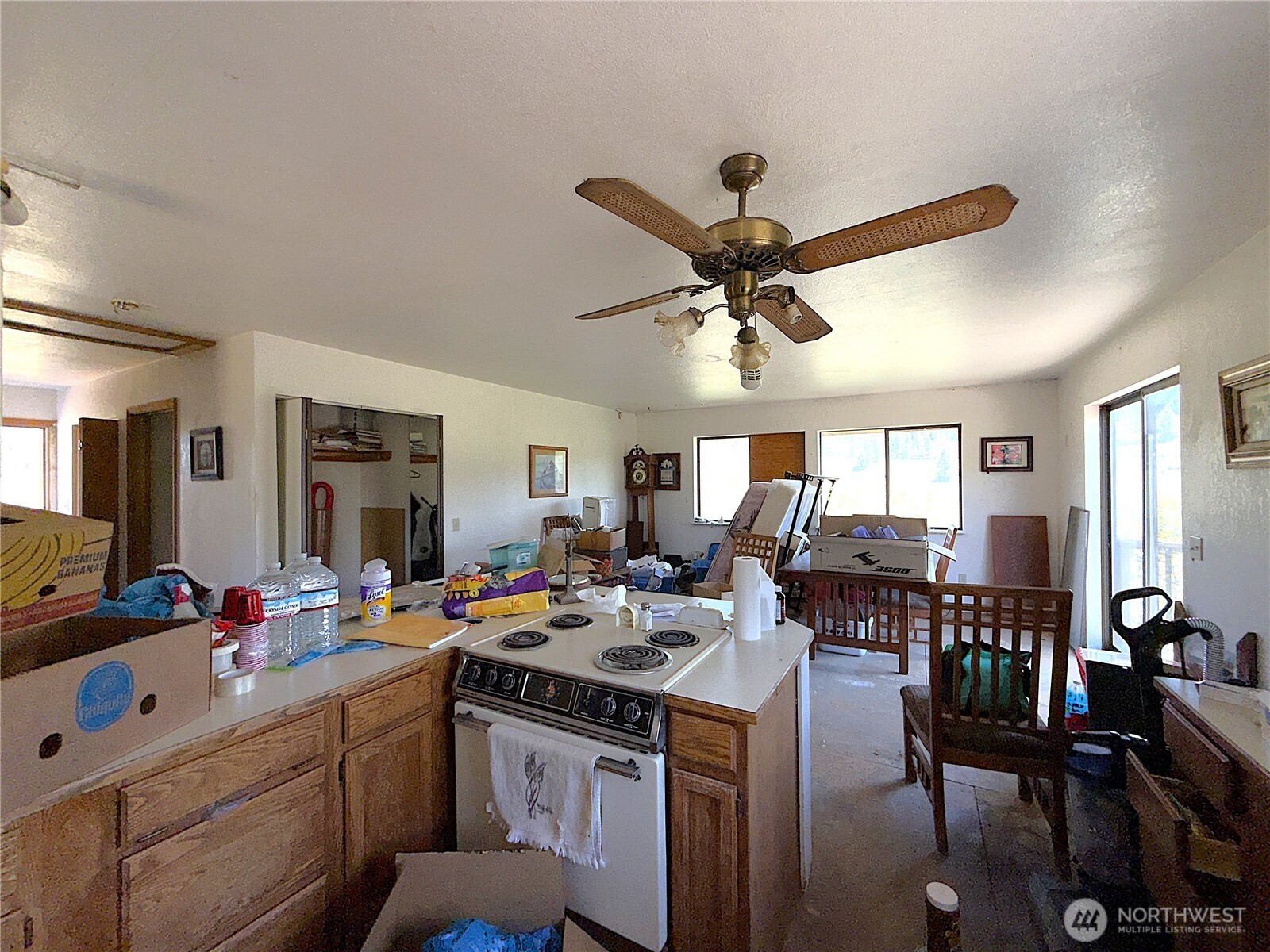 182 Kiwanis Road Republic, WA 99166 - Photo 3 of 13 a kitchen with a dining table chairs workspace and living room view