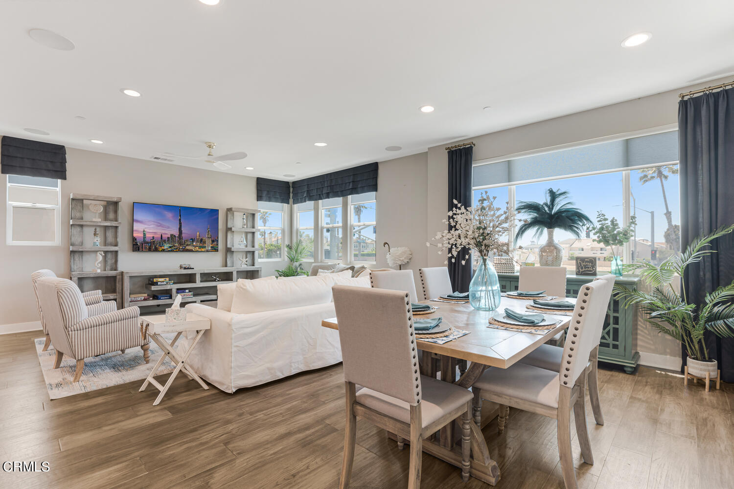 1028 Harbor Boulevard Oxnard, CA 93035 - Photo 11 of 48 a living room with furniture a large window and a flat screen tv