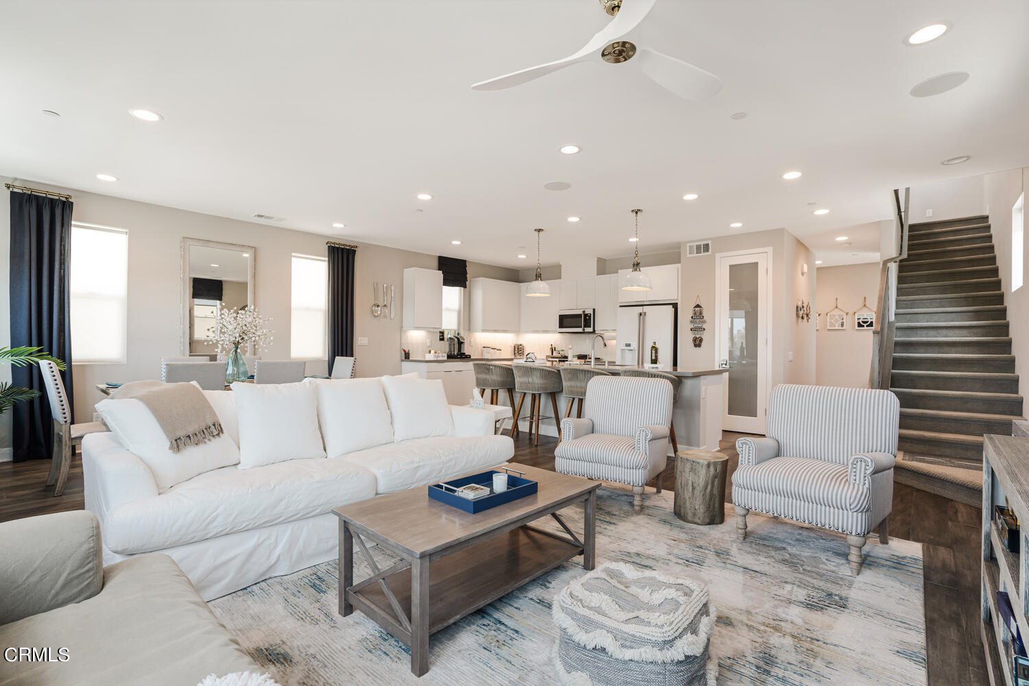 1028 Harbor Boulevard Oxnard, CA 93035 - Photo 12 of 48 a living room with lots of furniture and kitchen view