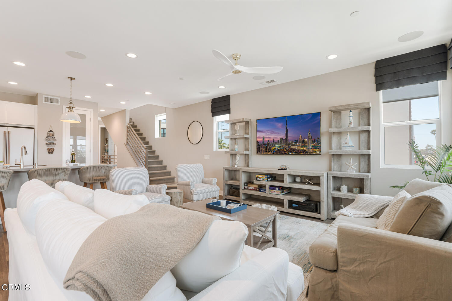 1028 Harbor Boulevard Oxnard, CA 93035 - Photo 13 of 48 a living room with furniture a flat screen tv and kitchen view