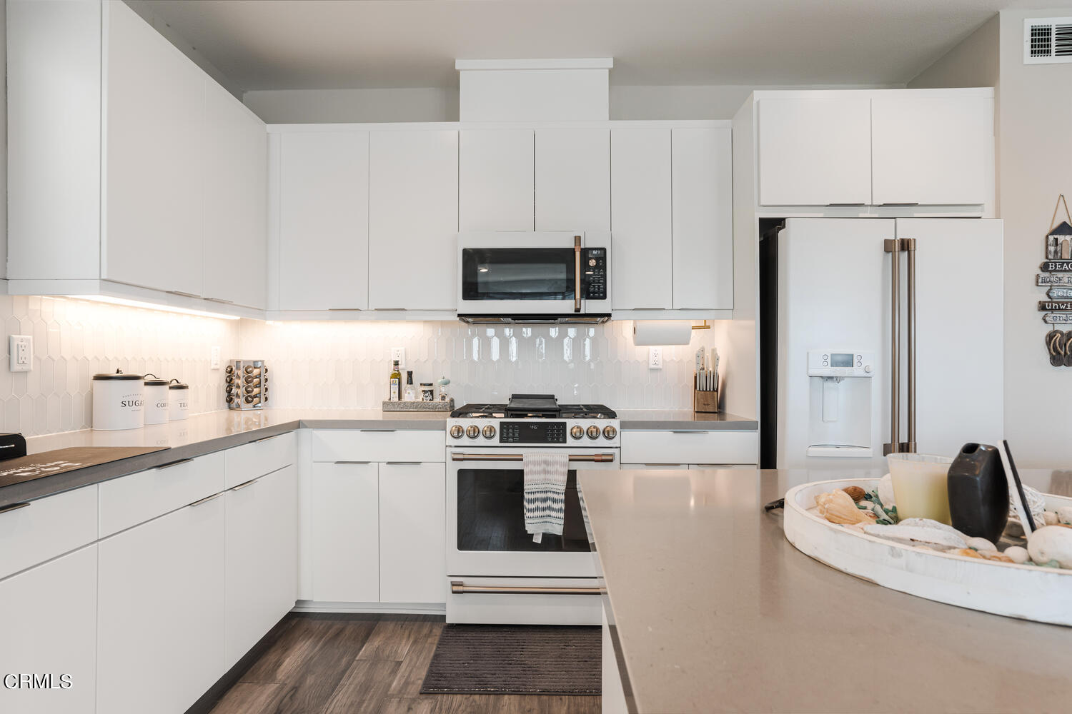 1028 Harbor Boulevard Oxnard, CA 93035 - Photo 16 of 48 a kitchen with stainless steel appliances a stove sink and refrigerator