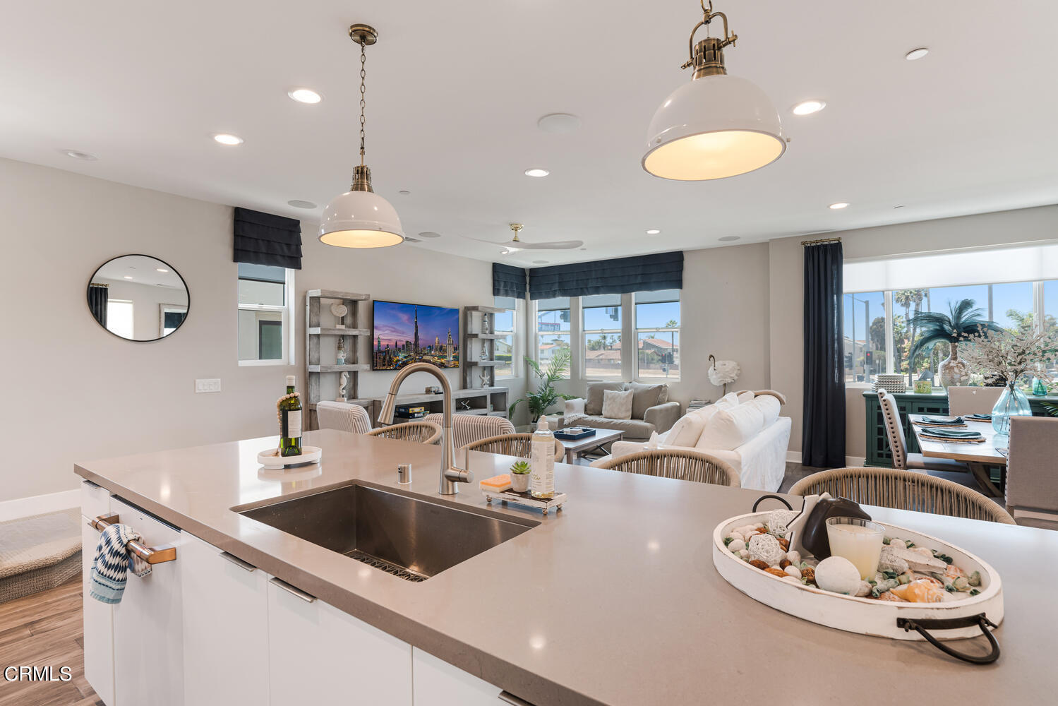 1028 Harbor Boulevard Oxnard, CA 93035 - Photo 18 of 48 a kitchen with a sink a counter and chairs