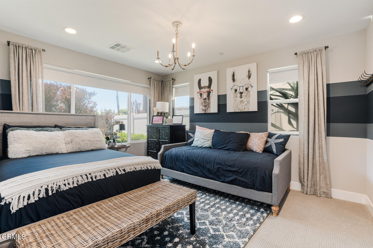 1028 Harbor Boulevard Oxnard, CA 93035 - Photo 30 of 48 a bedroom with two beds and a chandelier