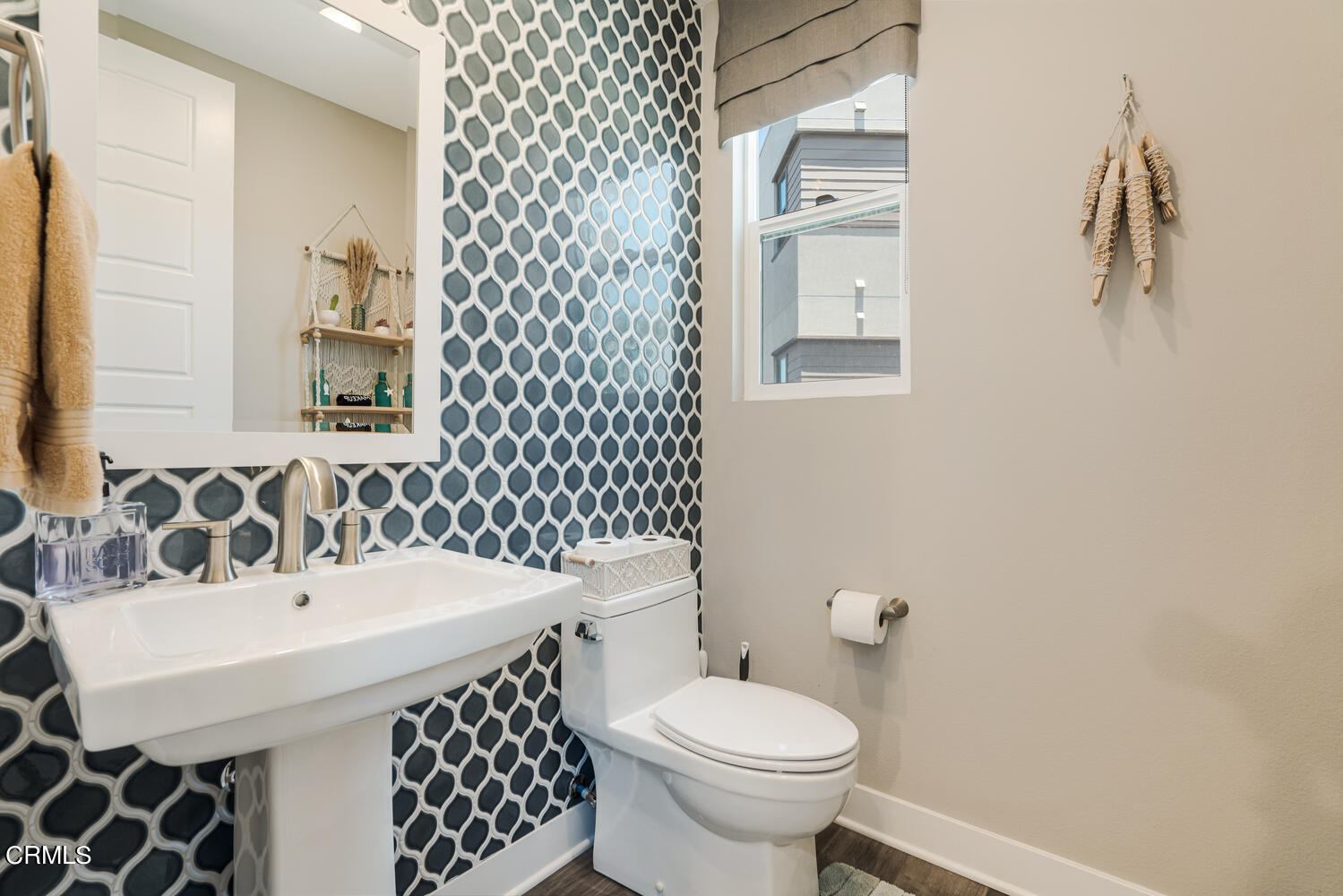 1028 Harbor Boulevard Oxnard, CA 93035 - Photo 32 of 48 a bathroom with a sink and a toilet