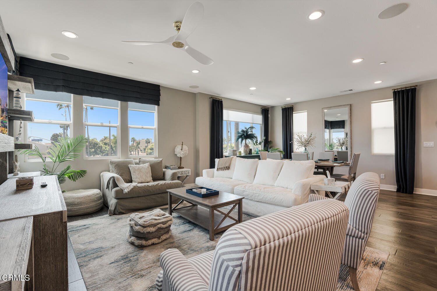 1028 Harbor Boulevard Oxnard, CA 93035 - Photo 8 of 48 a living room with furniture wooden floor and a large window