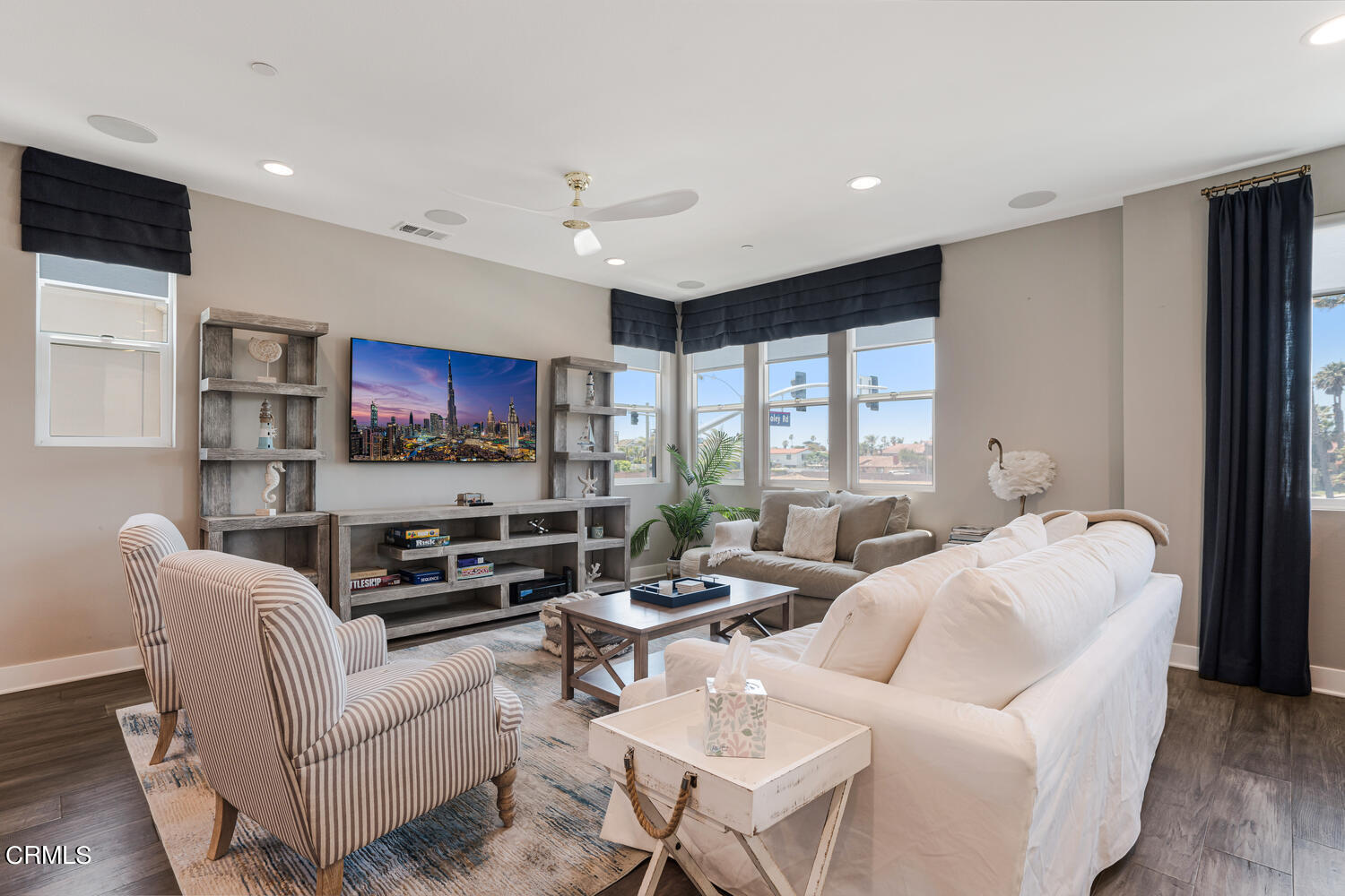 1028 Harbor Boulevard Oxnard, CA 93035 - Photo 10 of 48 a living room with furniture and a flat screen tv
