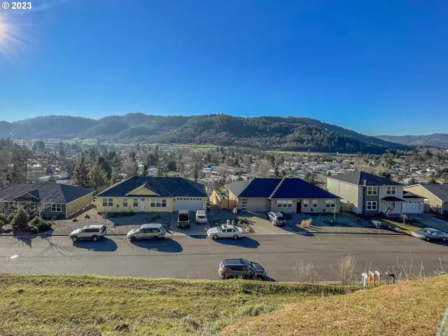 a view of multiple houses with outdoor space