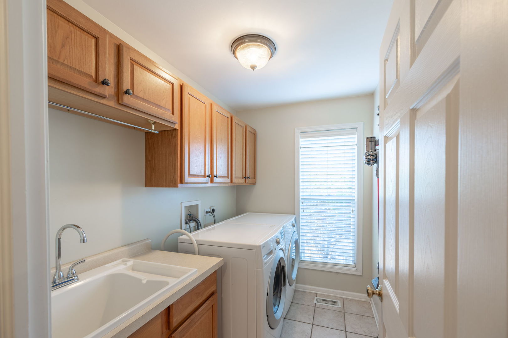 3040 Wagner Road Aurora, IL 60502 - Photo 14 of 37 a bathroom with a sink and a mirror