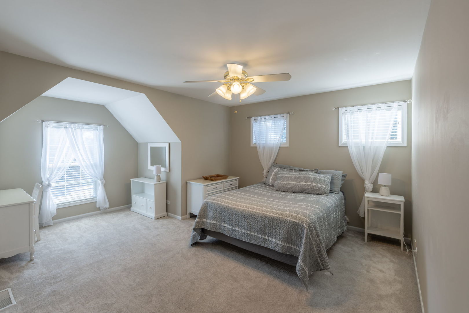 3040 Wagner Road Aurora, IL 60502 - Photo 20 of 37 a spacious bedroom with a bed and a chandelier