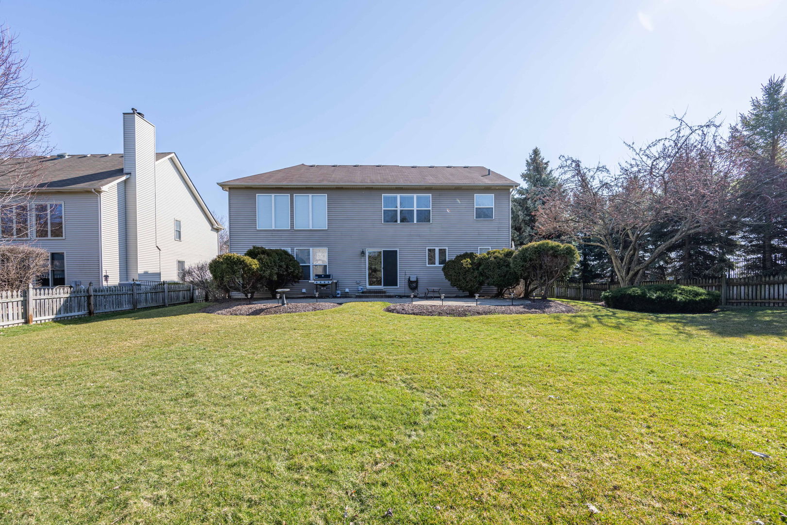 3040 Wagner Road Aurora, IL 60502 - Photo 29 of 37 a front view of house with yard and trees in the background