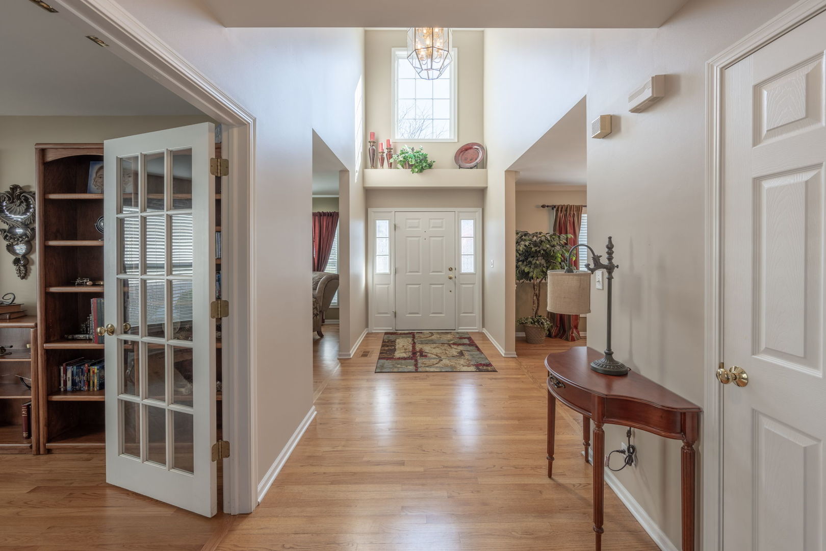 3040 Wagner Road Aurora, IL 60502 - Photo 3 of 37 a view of a hallway view with wooden floor and staircase