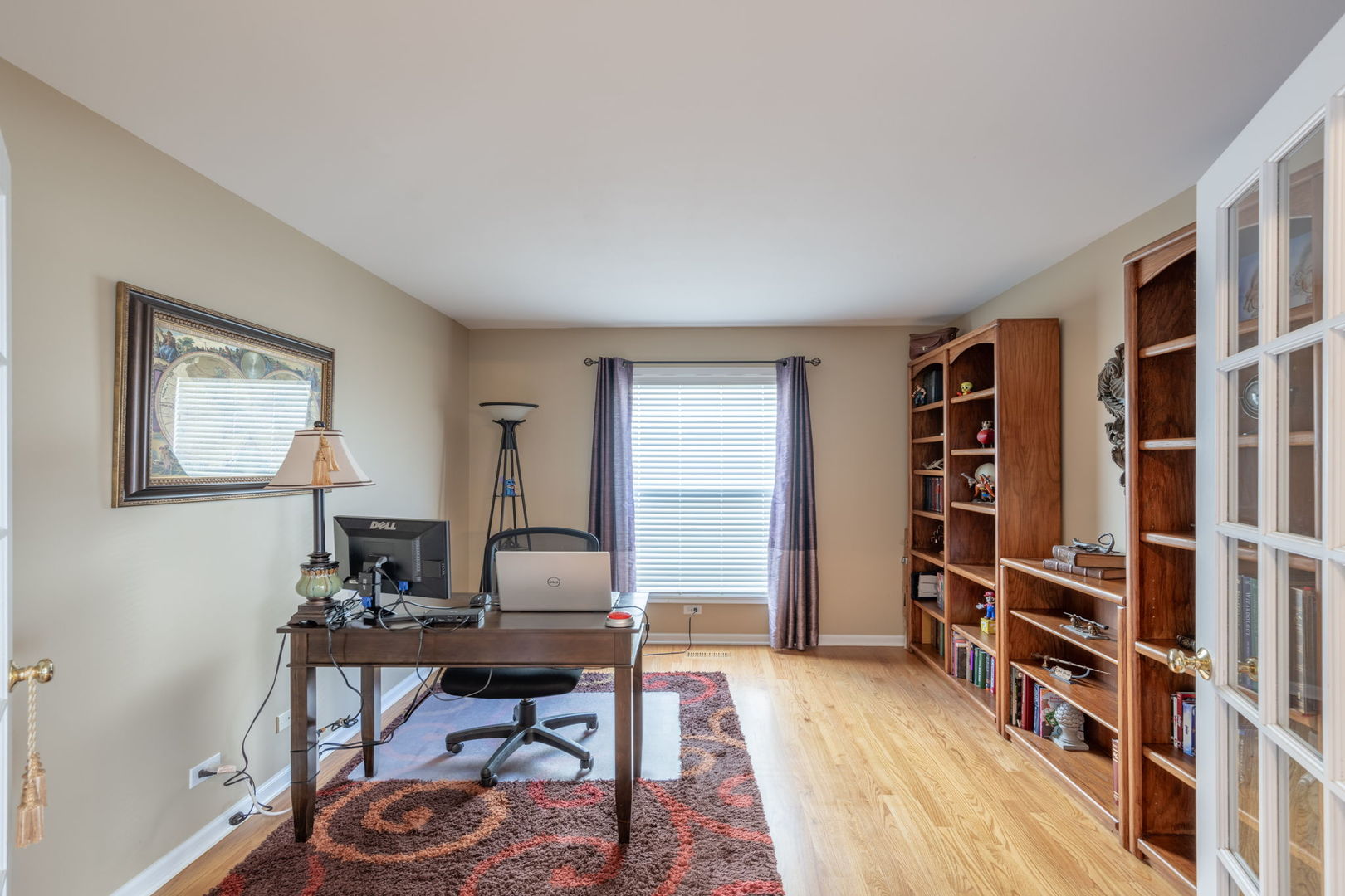 3040 Wagner Road Aurora, IL 60502 - Photo 7 of 37 a view of a workspace with furniture and a bookshelf