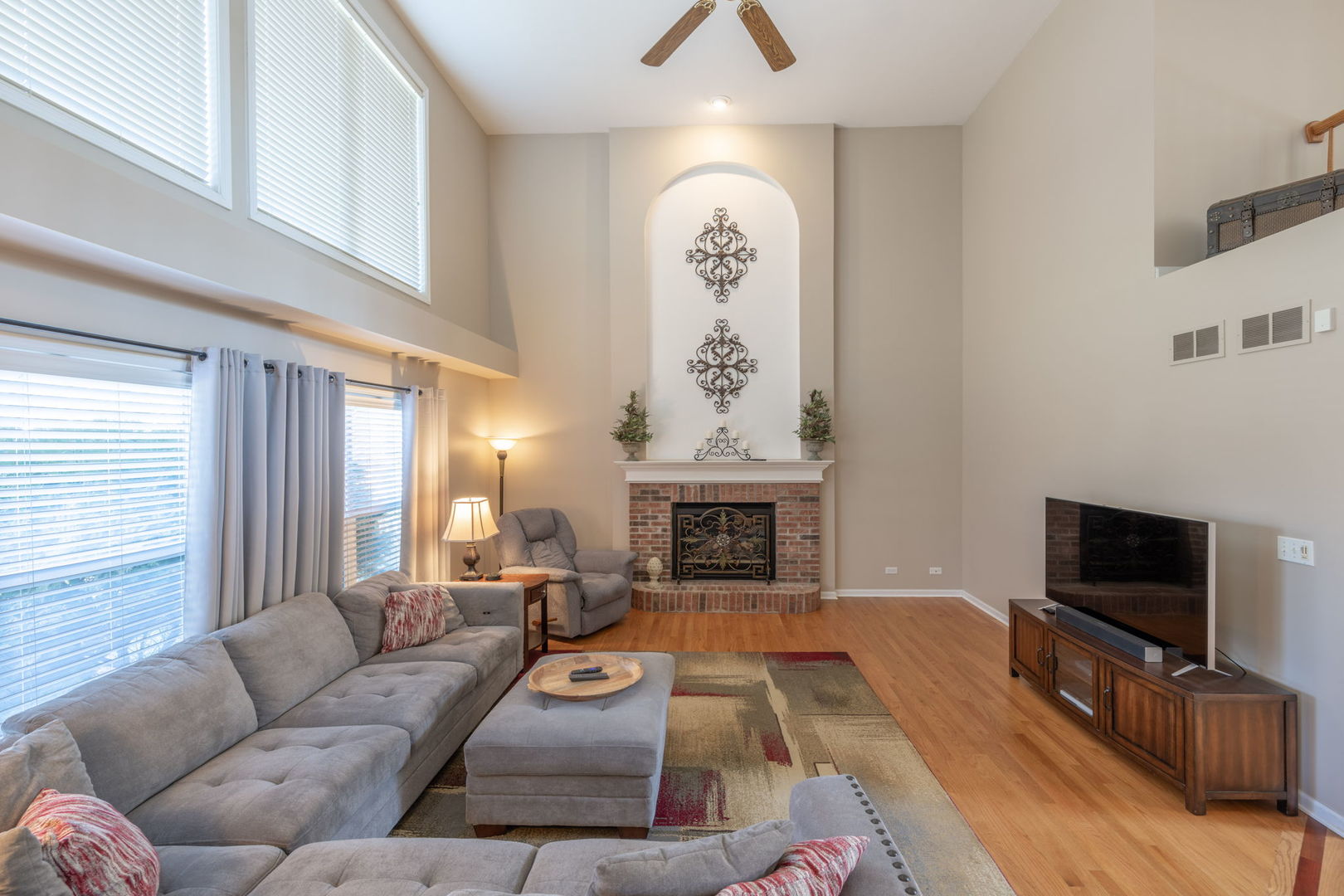 3040 Wagner Road Aurora, IL 60502 - Photo 8 of 37 a living room with furniture fireplace and flat screen tv