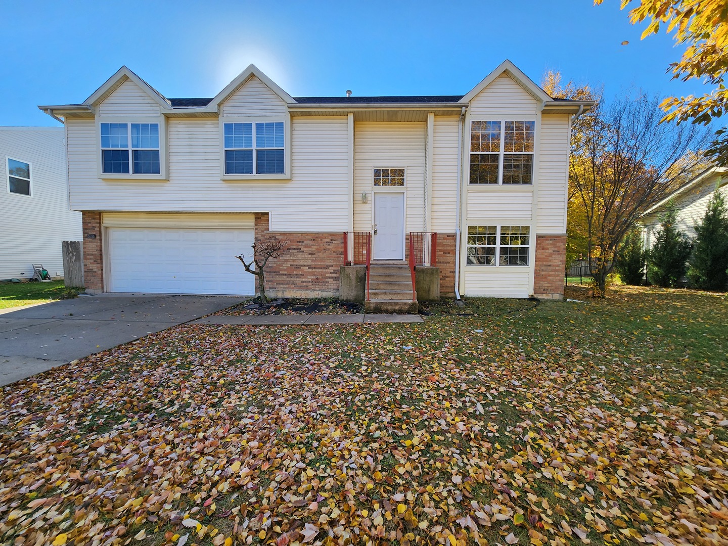 5216 Riviera Boulevard Plainfield, IL 60586 - Photo 1 of 14 a front view of a house with garden