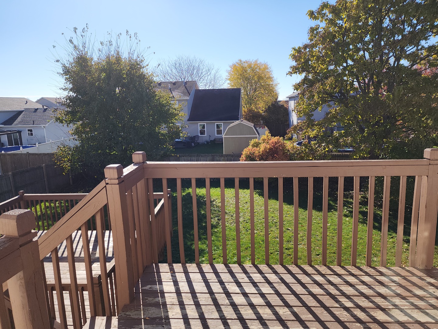 5216 Riviera Boulevard Plainfield, IL 60586 - Photo 12 of 14 a view of balcony with wooden floor and fence