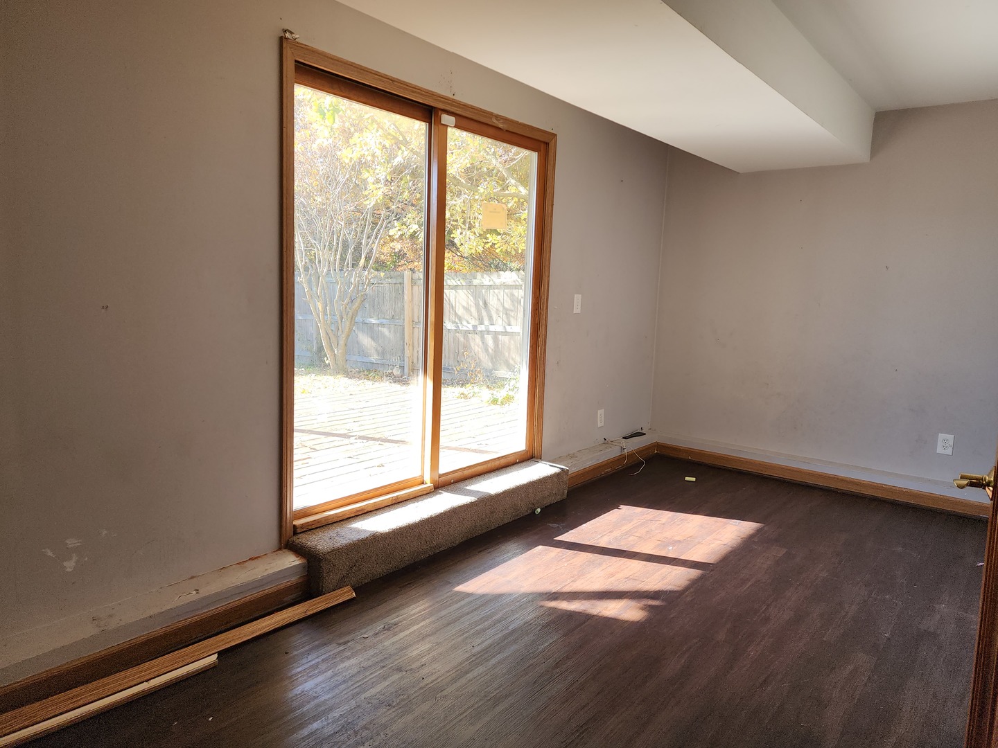 5216 Riviera Boulevard Plainfield, IL 60586 - Photo 13 of 14 an empty room with wooden floor and windows