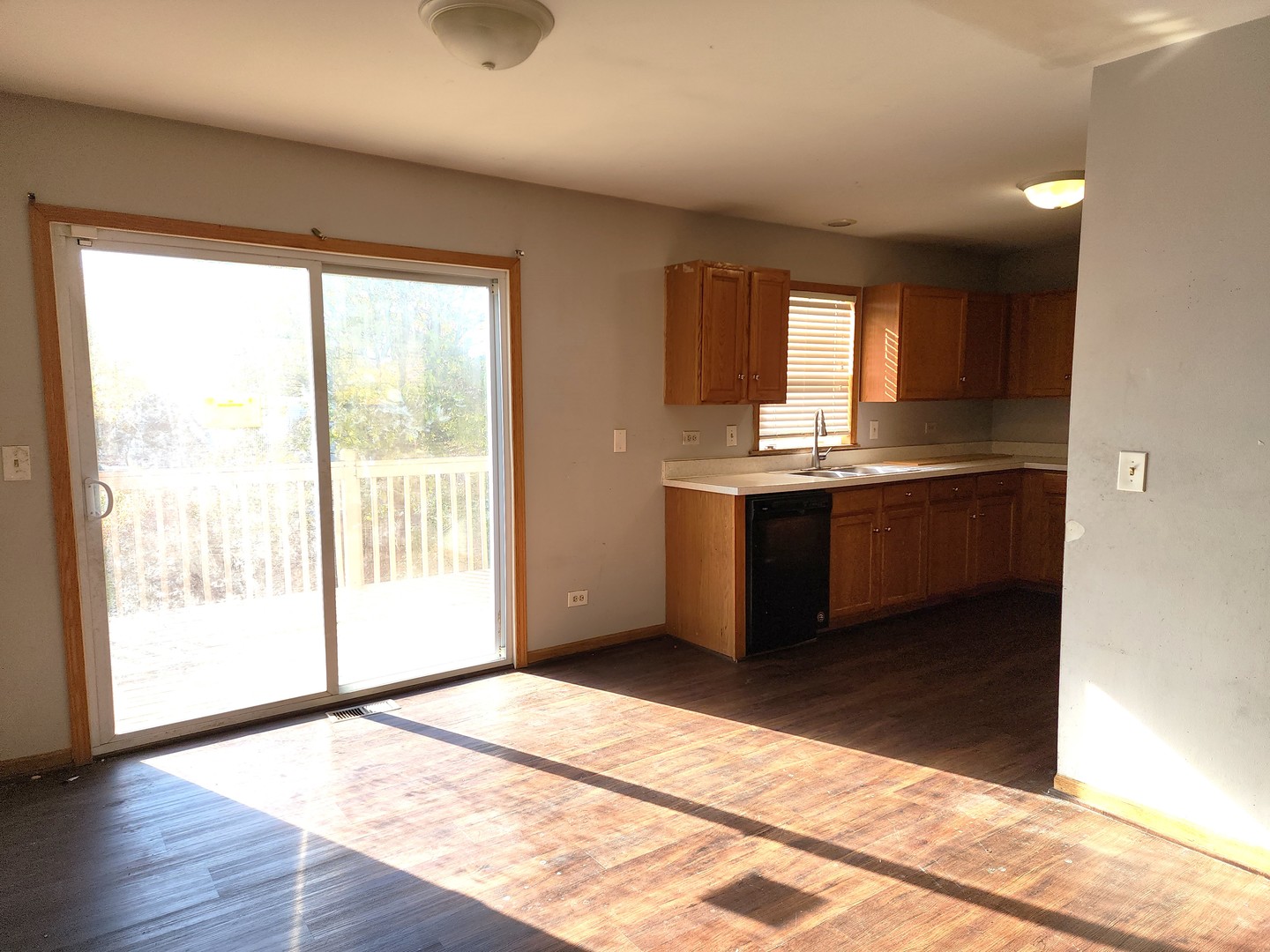 5216 Riviera Boulevard Plainfield, IL 60586 - Photo 3 of 14 a view of a kitchen with wooden floor and a sink