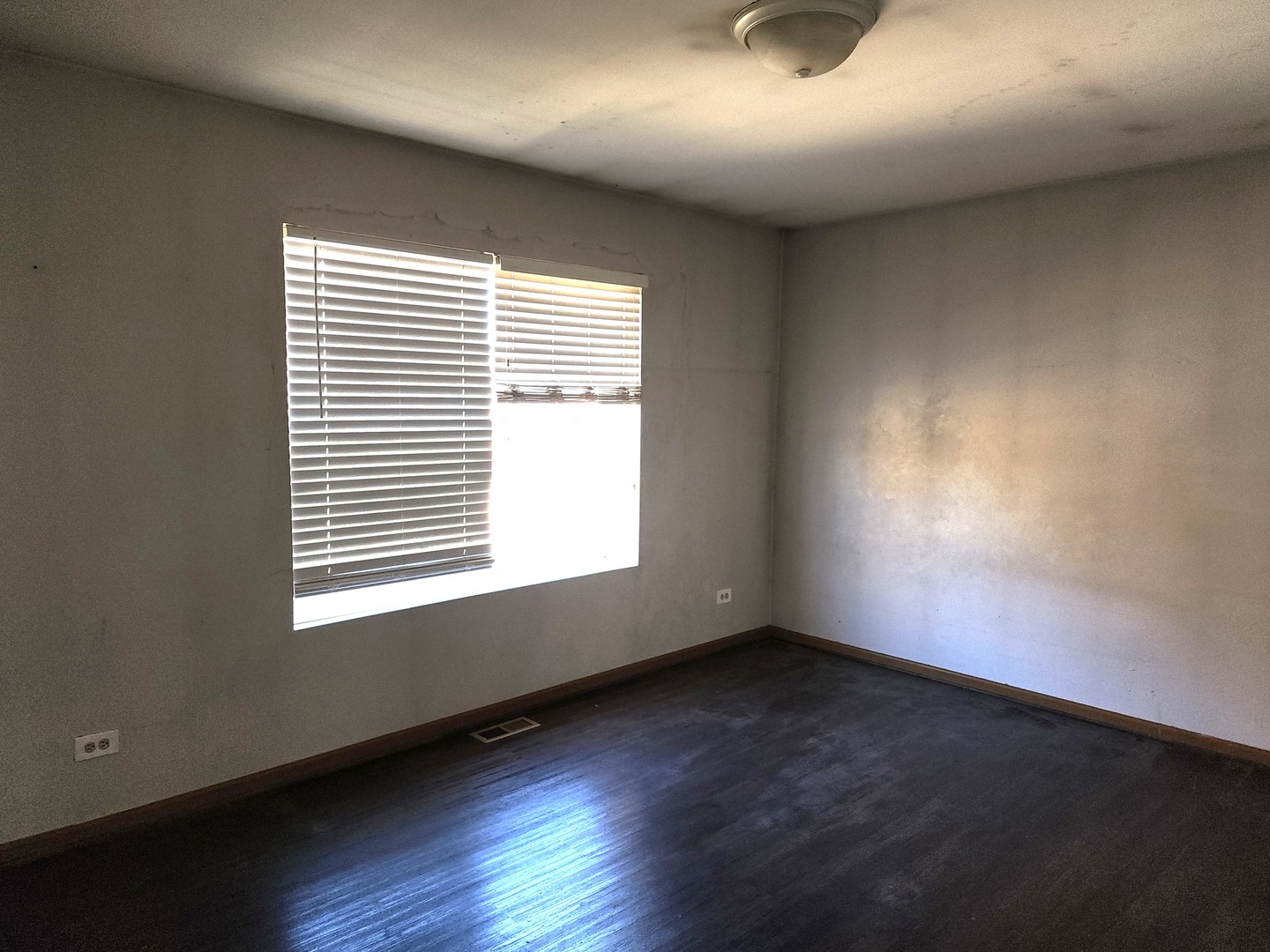 5216 Riviera Boulevard Plainfield, IL 60586 - Photo 7 of 14 an empty room with wooden floor and windows