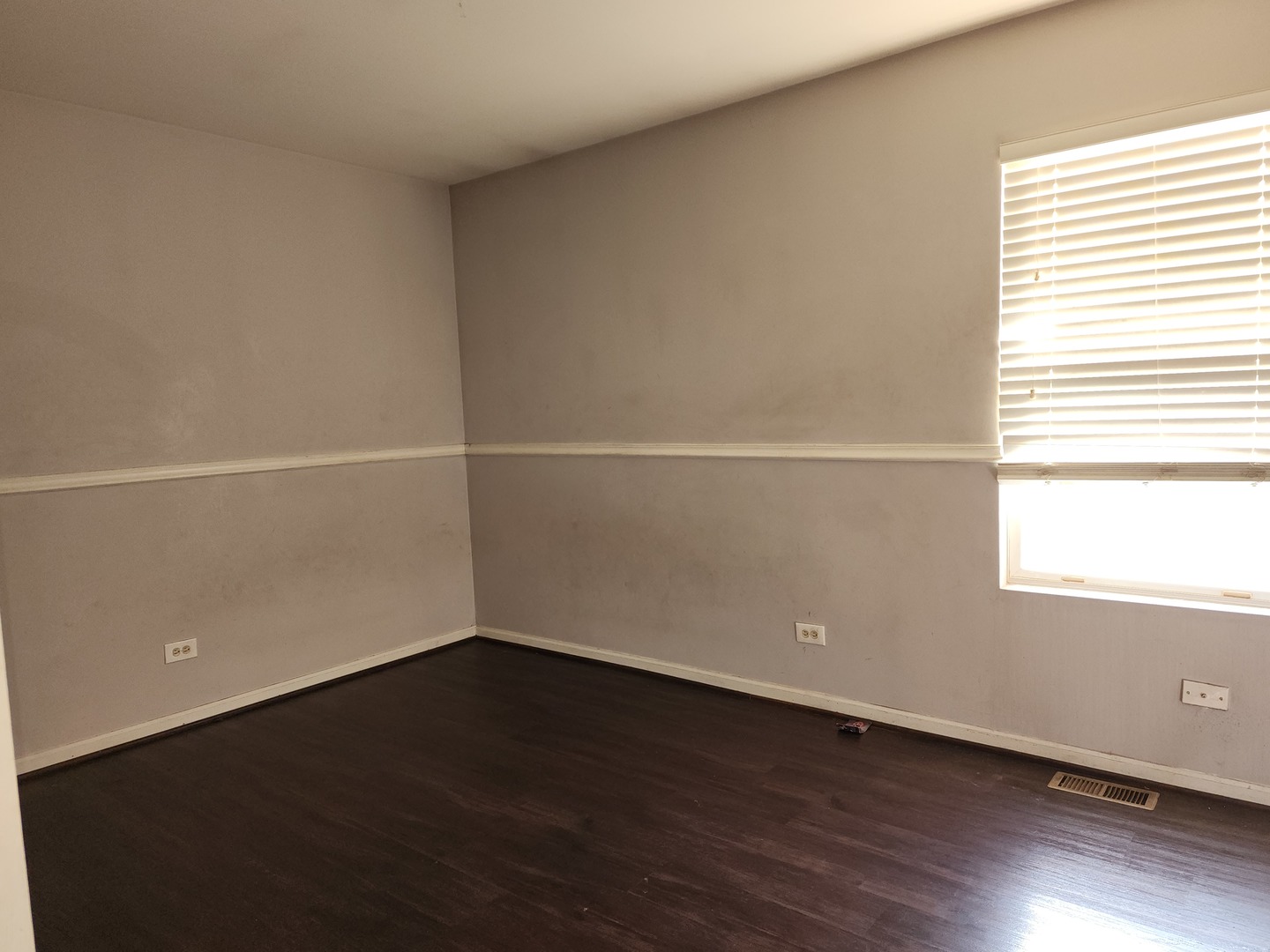 5216 Riviera Boulevard Plainfield, IL 60586 - Photo 9 of 14 an empty room with wooden floor and windows