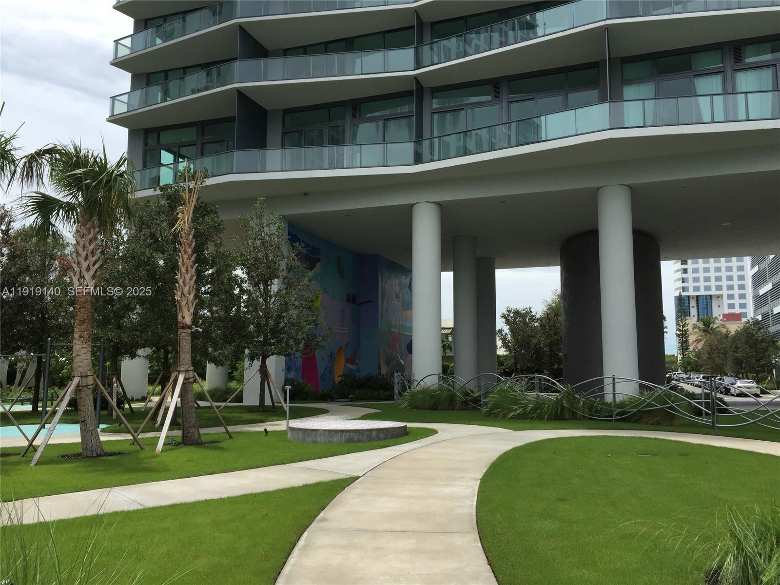 460 Northeast 28th Street, Unit 3707 Miami, FL 33137 - Photo 12 of 12 front view of a building with a yard