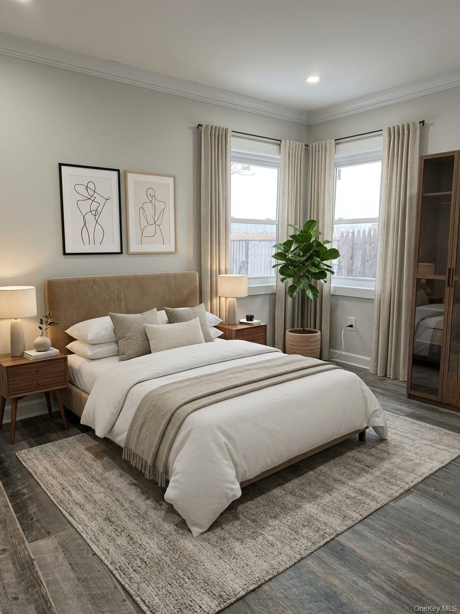 11 Bayview Avenue Lawrence, NY 11559 - Photo 11 of 18 a bedroom with a large bed and a chandelier
