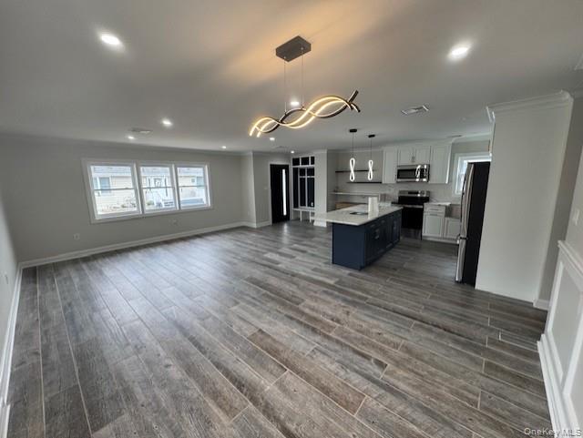 11 Bayview Avenue Lawrence, NY 11559 - Photo 3 of 18 a living room with stainless steel appliances kitchen island hardwood floor and a window