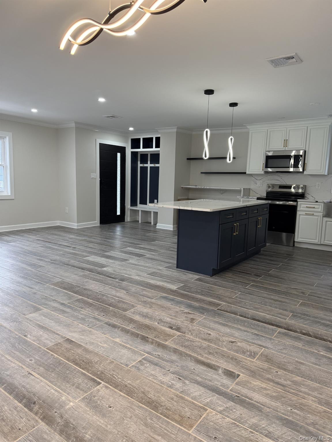 11 Bayview Avenue Lawrence, NY 11559 - Photo 4 of 18 a large room with kitchen view
