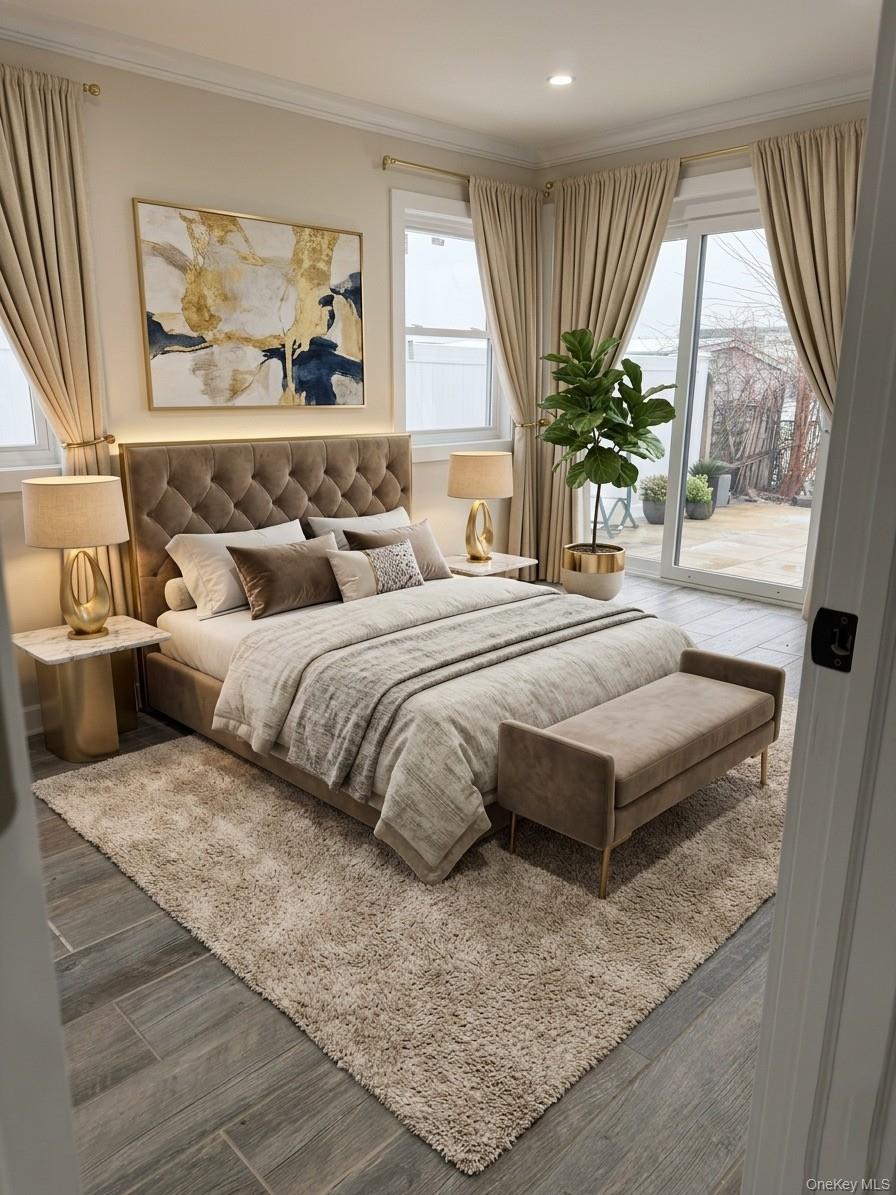 11 Bayview Avenue Lawrence, NY 11559 - Photo 10 of 18 a bedroom with a large bed and a large window