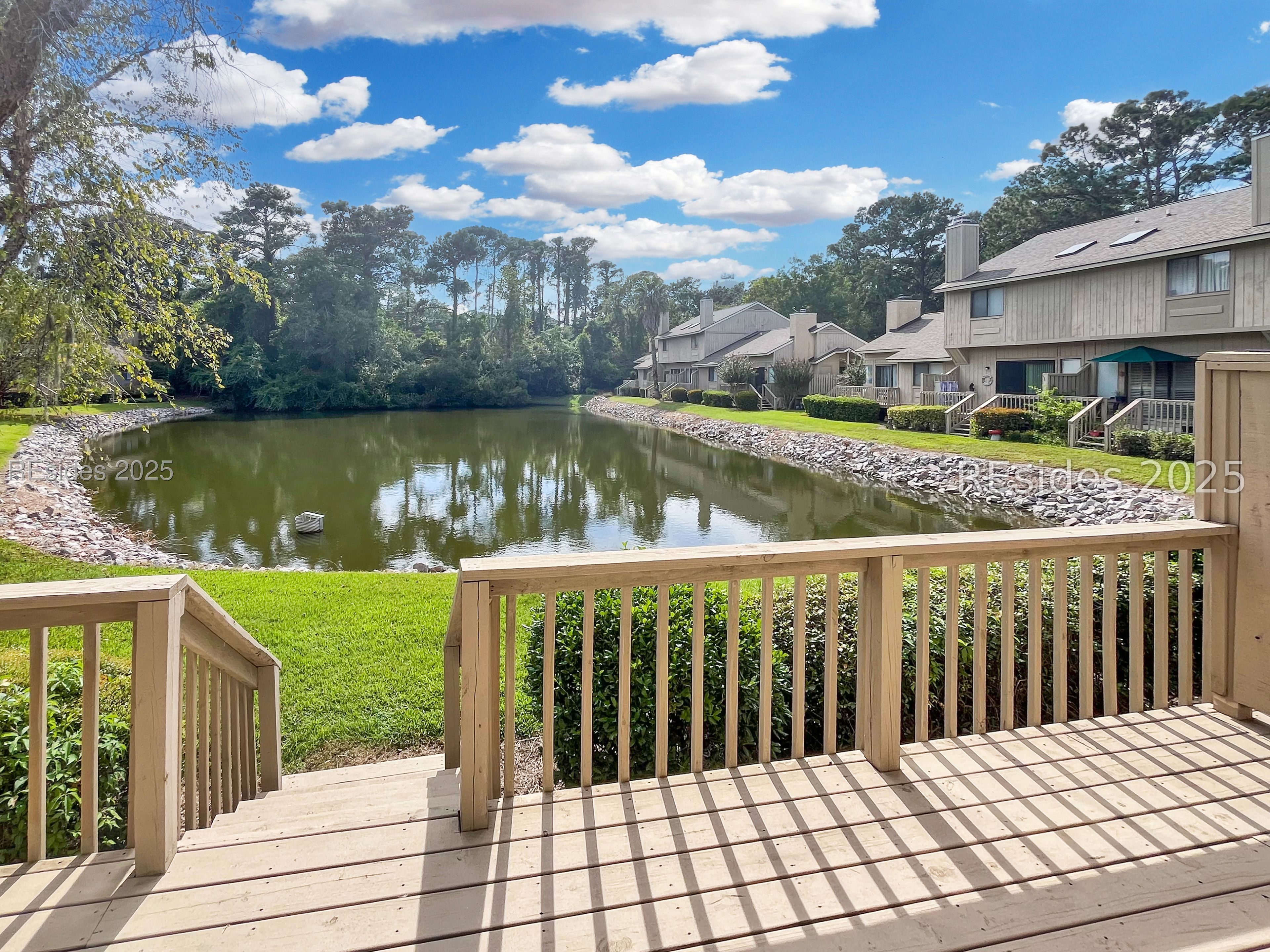5 Gumtree Road, Unit M6 Hilton Head Island, SC 29926 - Photo 1 of 1 Private rear deck with lagoon and wood view