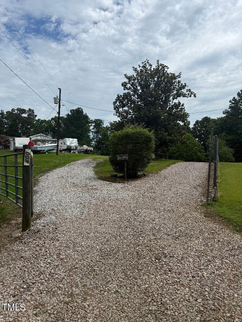 394 Flanagan Road Henderson, NC 27537 - Photo 50 of 54 Turning off Flanagan Rd into driveway, Keep to the Right along the fence line.
