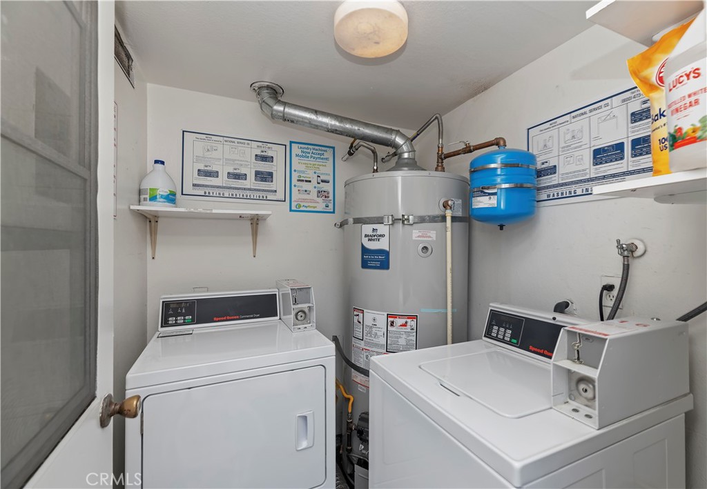 16406 Vista Roma Circle, Unit 115 Huntington Beach, CA 92649 - Photo 22 of 26 a utility room with dryer and washer