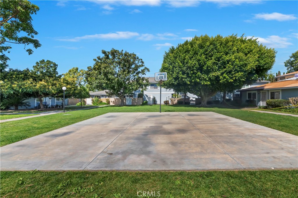 16406 Vista Roma Circle, Unit 115 Huntington Beach, CA 92649 - Photo 25 of 26 a view of road with yard