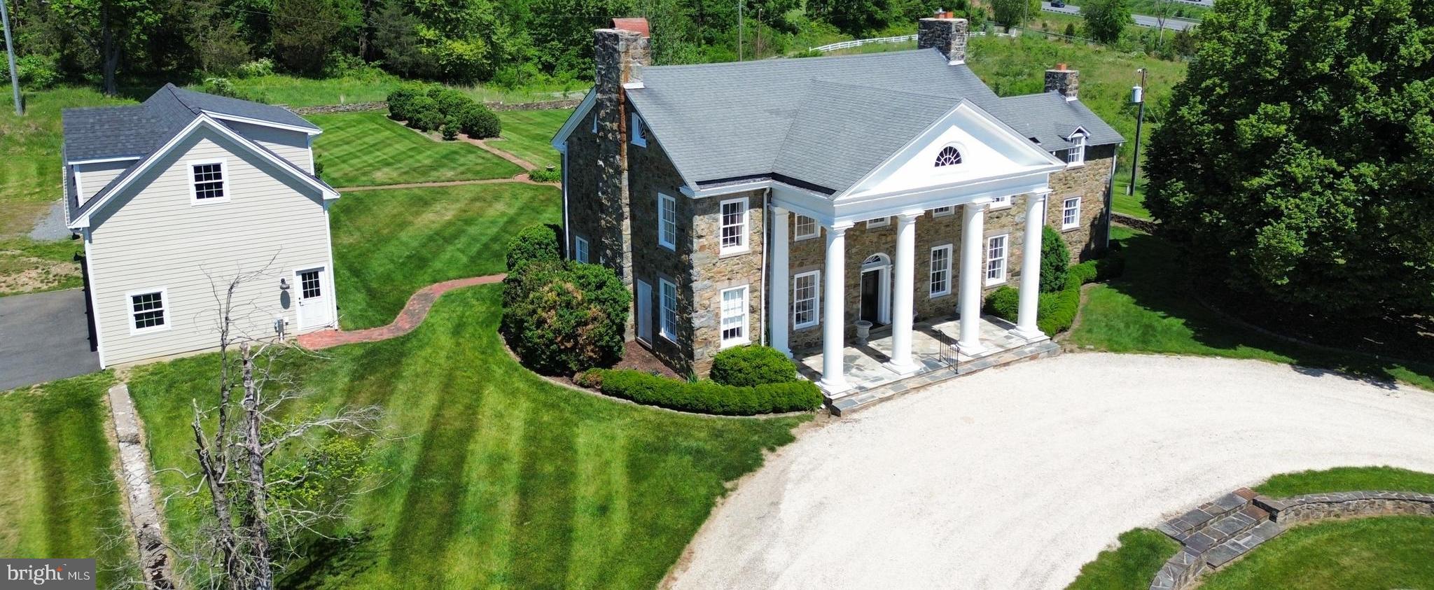 17781 Roxbury Hall Road Leesburg, VA 20175 - Photo 6 of 107 a aerial view of a house with a yard and potted plants