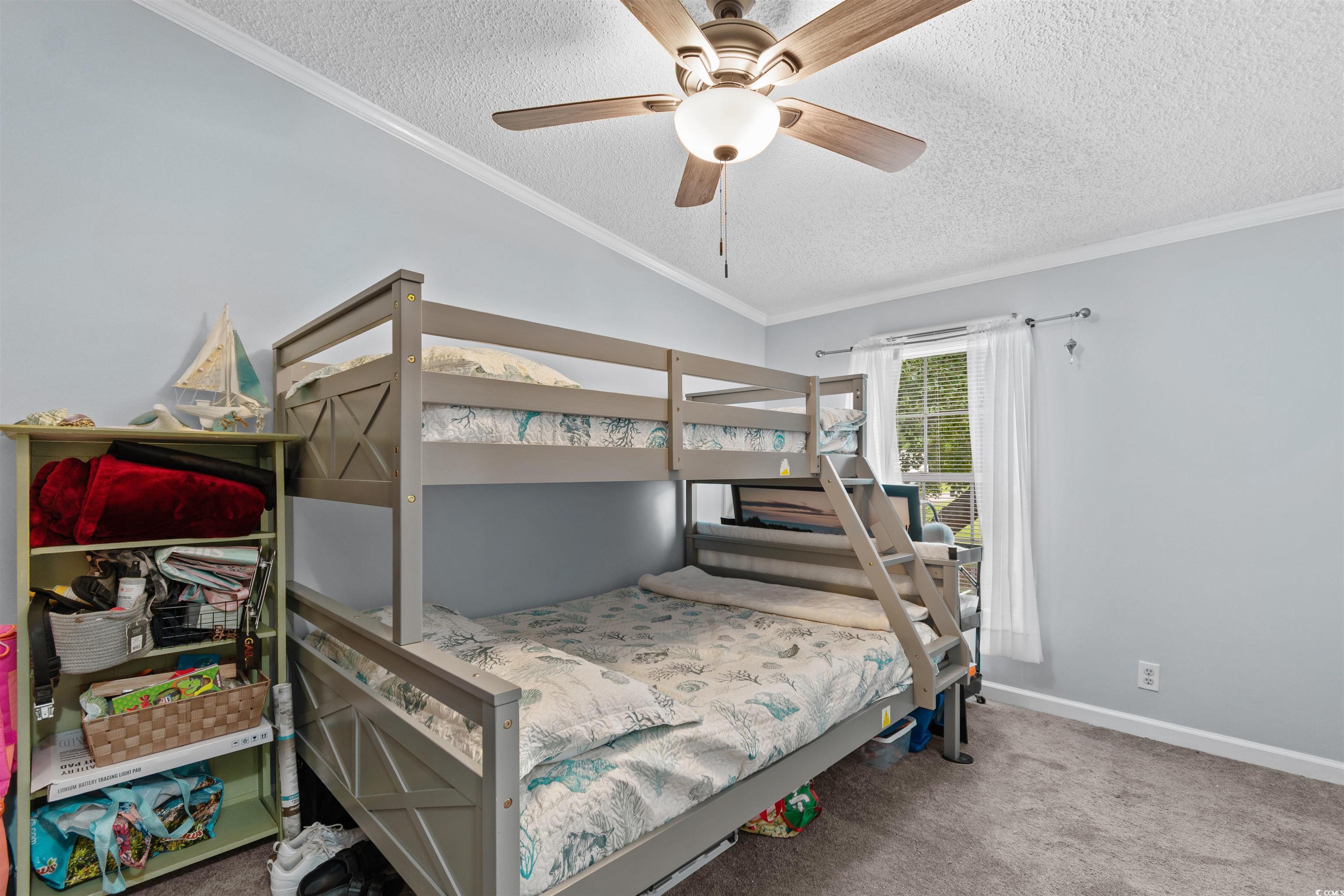 11140 Mcdowell Shortcut Road Murrells Inlet, SC 29576 - Photo 20 of 33 Carpeted bedroom with crown molding, a textured ceiling, lofted ceiling, and ceiling fan