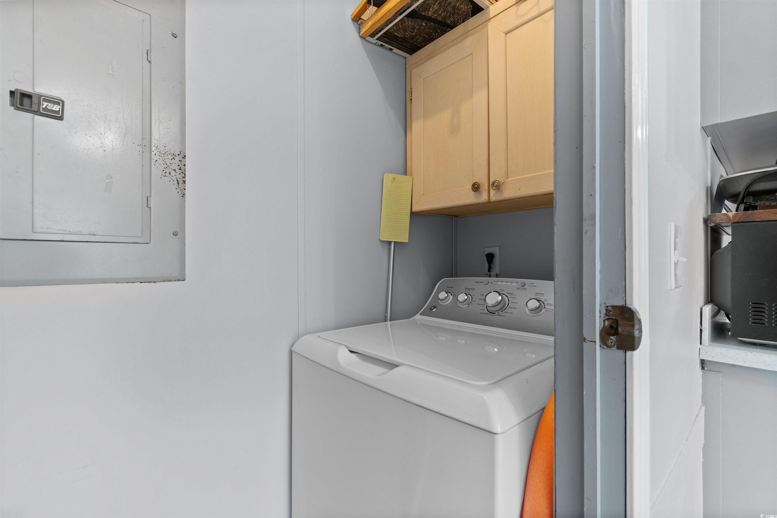 11140 Mcdowell Shortcut Road Murrells Inlet, SC 29576 - Photo 24 of 33 Laundry area with cabinet space, washer / dryer, and electric panel