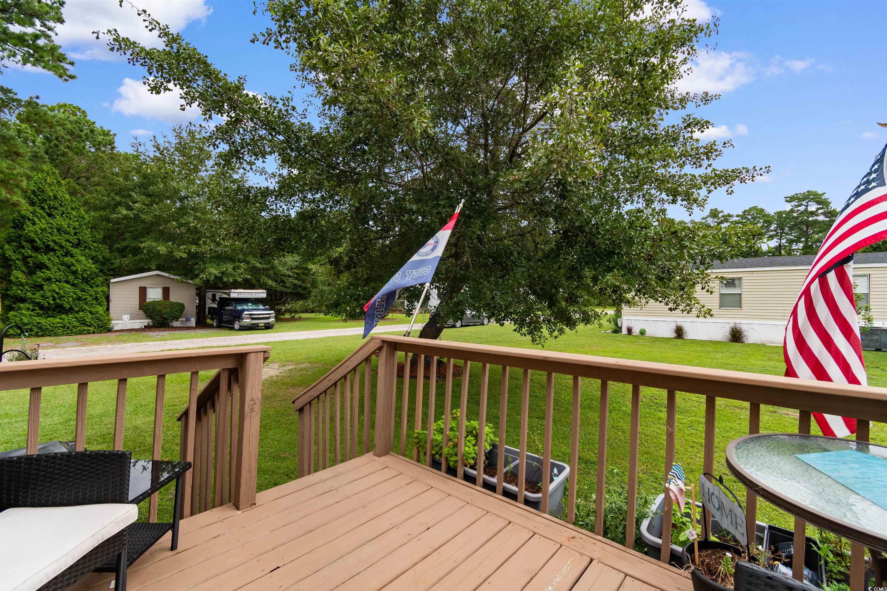 11140 Mcdowell Shortcut Road Murrells Inlet, SC 29576 - Photo 27 of 33 Wooden deck with a yard