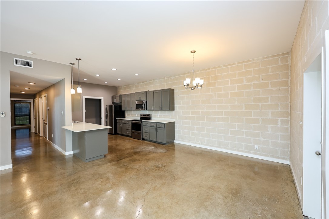 306 Easy Street, Unit A Corpus Christi, TX 78418 - Photo 4 of 22 a large kitchen with a sink and cabinets