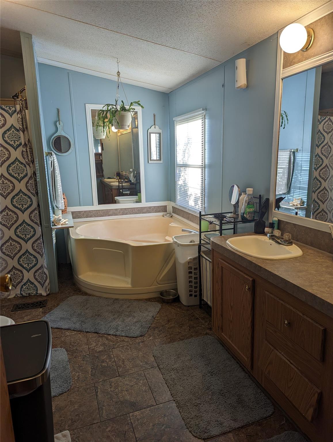 21824 Joy Road Locust, NC 28097 - Photo 12 of 24 a spacious bathroom with a tub sink and mirror