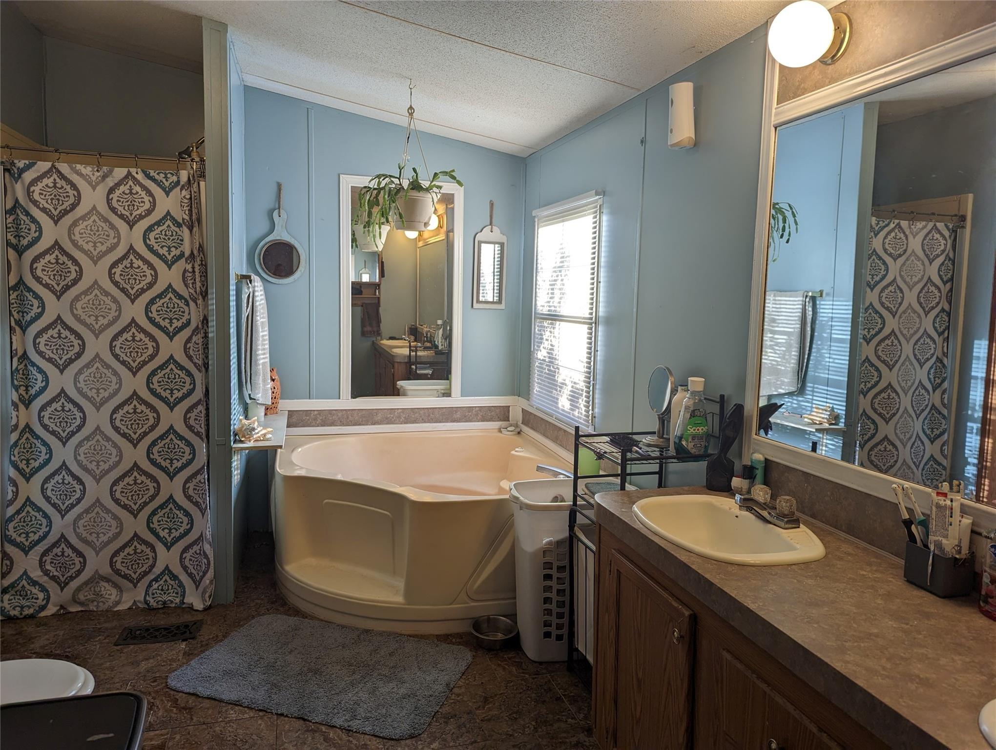 21824 Joy Road Locust, NC 28097 - Photo 13 of 24 a bathroom with a sink and a mirror