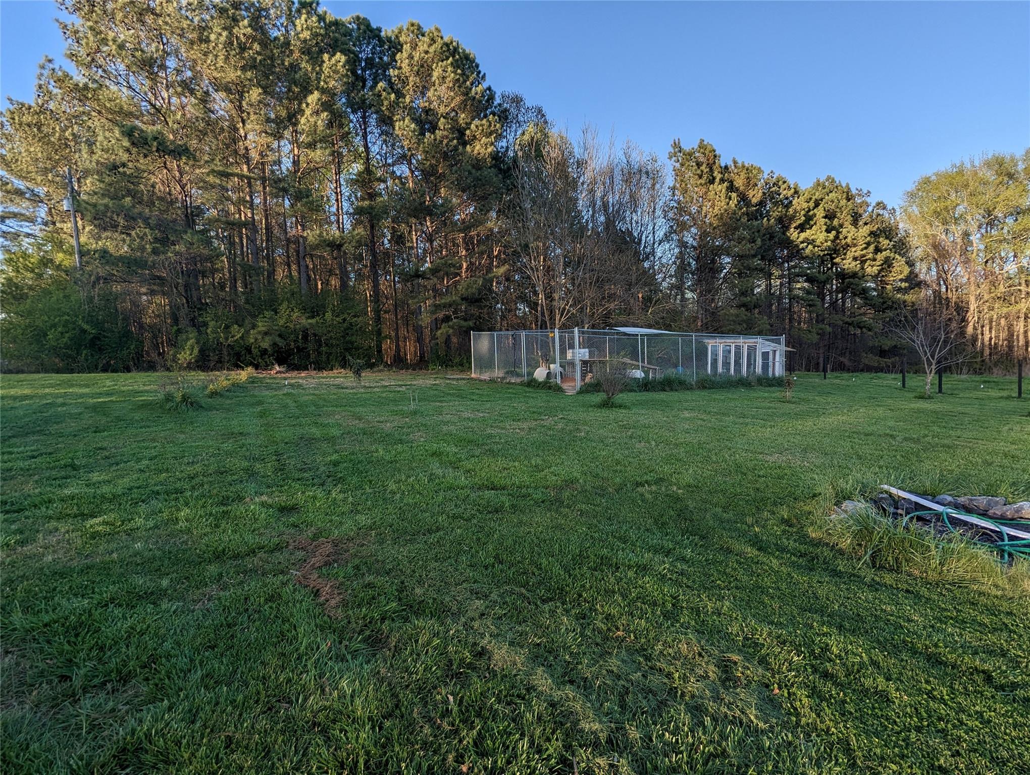 21824 Joy Road Locust, NC 28097 - Photo 18 of 24 a view of a field of grass and trees
