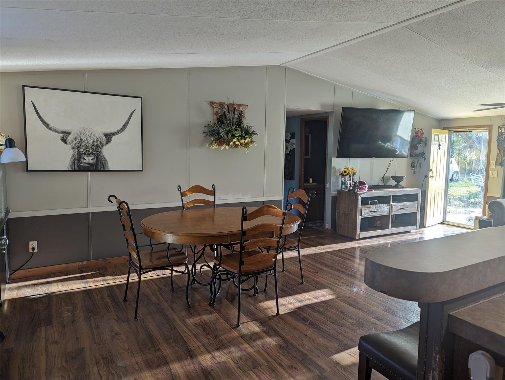 21824 Joy Road Locust, NC 28097 - Photo 3 of 24 a view of a dining room with furniture window and wooden floor