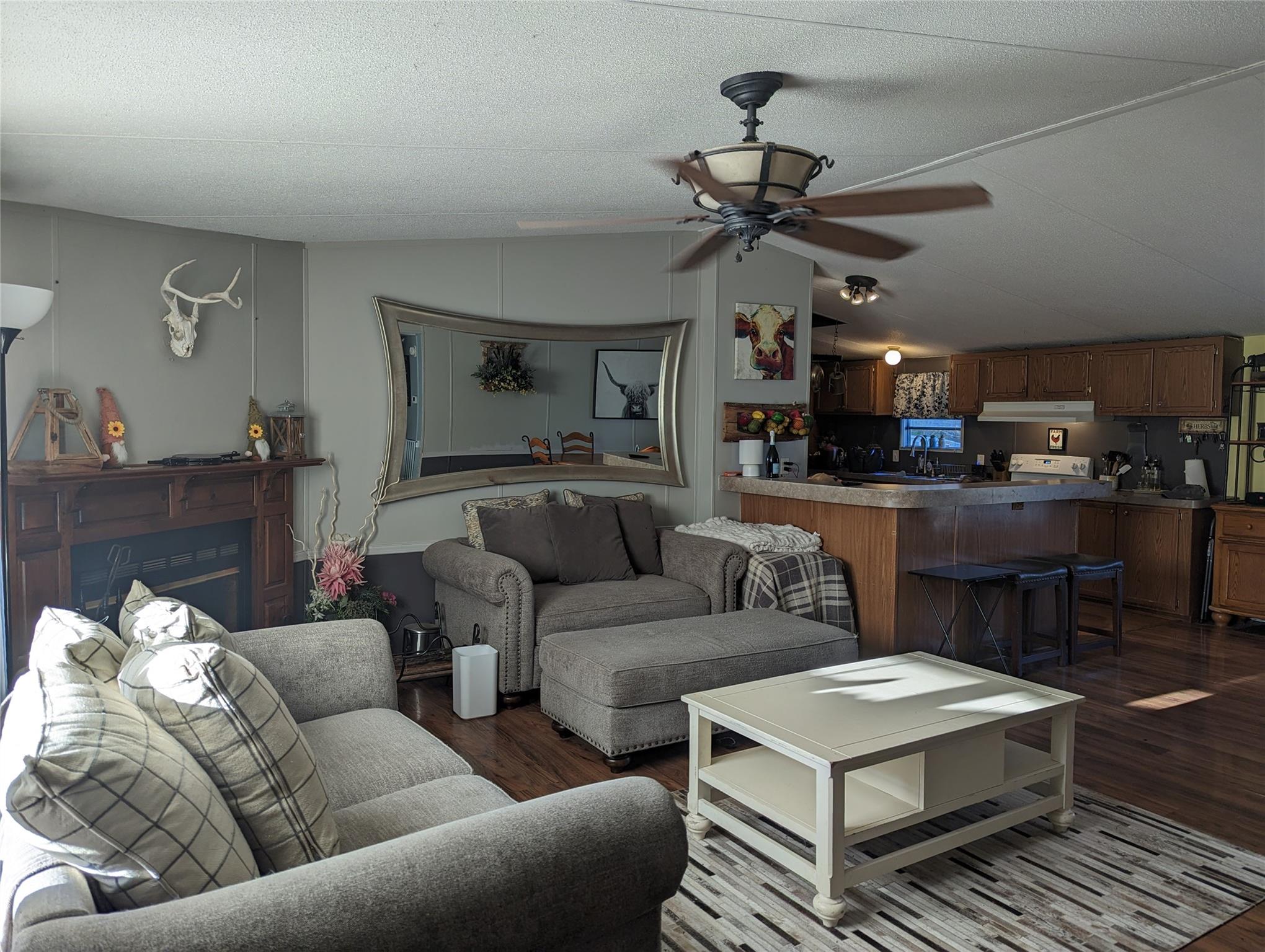 21824 Joy Road Locust, NC 28097 - Photo 4 of 24 a living room with furniture and kitchen view