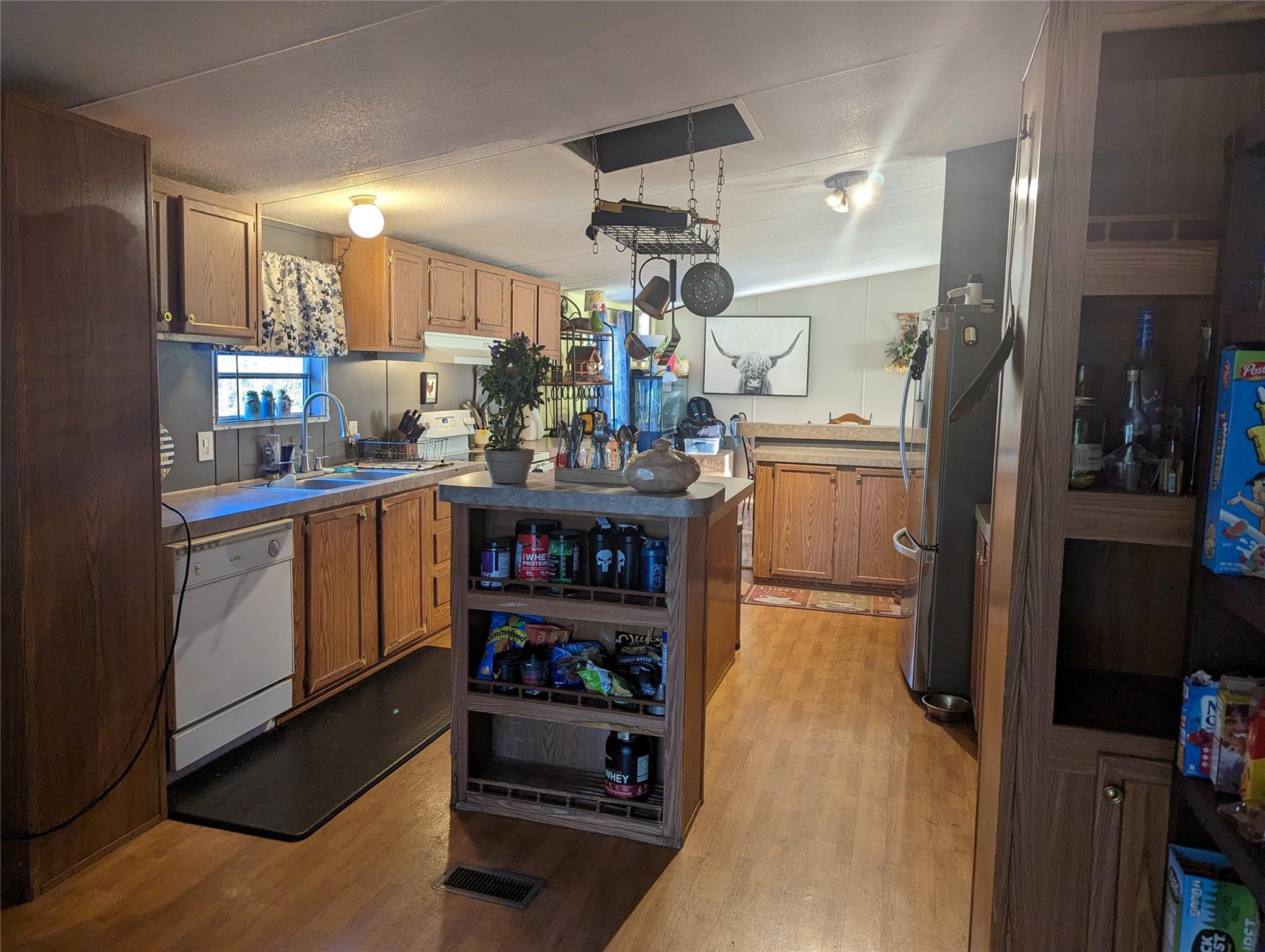 21824 Joy Road Locust, NC 28097 - Photo 10 of 24 a kitchen with refrigerator and cabinets