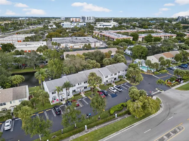 an aerial view of a house with a garden