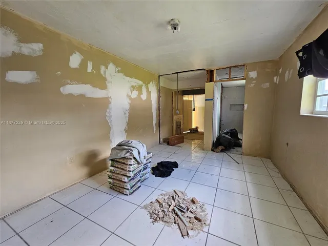 a bedroom with a bed and a shower