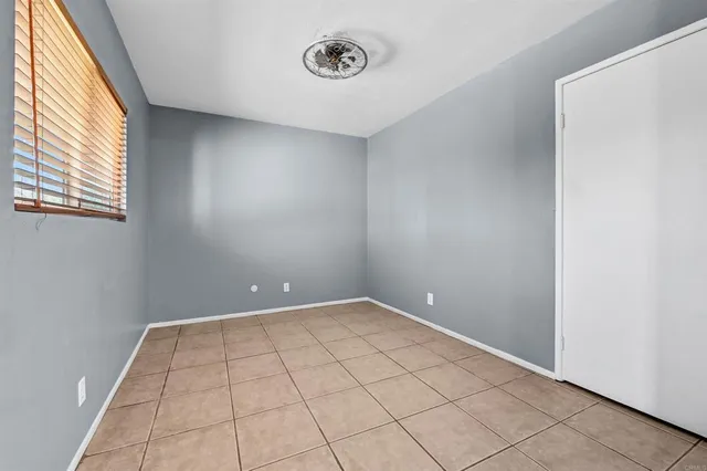 a view of an empty room and window